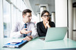 © F8  \ Suport Ukraine - Business partners working on new project at laptop in modern office