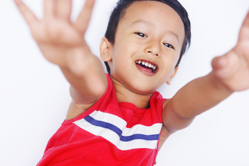 Cute asian child positive and real smile over white background