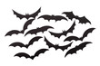 Silhouettes of volatile bats carved out of black paper are isolated on white