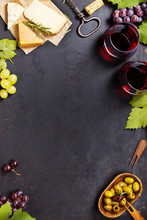 Wine Appetizers Set: French Cheese Selection, Grapes And Walnuts On Rustic Background