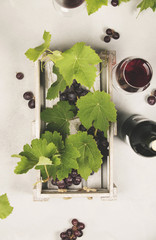 Canvas Print - Wine and grapes over grey marble background