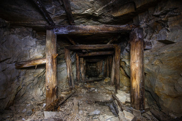 Old abandoned underground ore mica  mine shaft tunnel