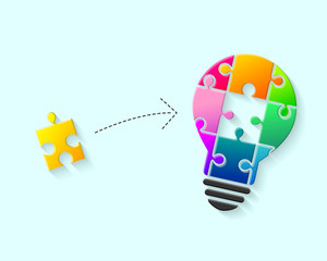 Wall Mural - colorful light bulb with puzzle piece as idea and solution concept