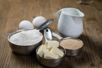 Wall Mural - Baking ingredients in measuring cups