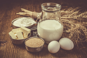 Wall Mural - Baking ingredients in measuring cups