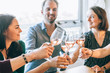 © Carlo - friends toasting together and having fun around a table