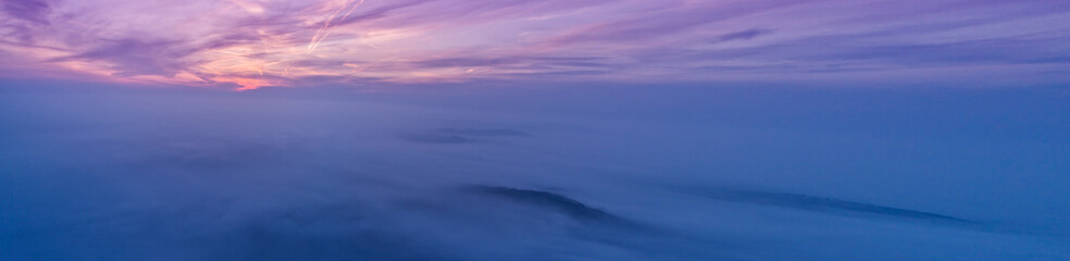 Wall Mural - Beautiful sunset above clouds