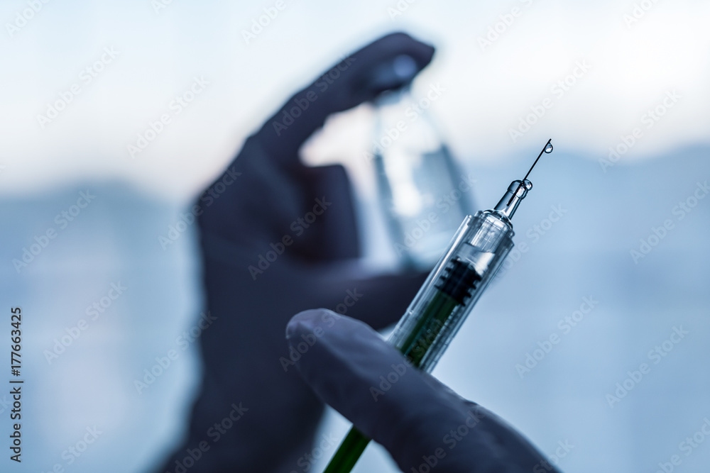 Syringe Injected Syringe, medical injection in hand. Vaccination equipment. Stock Photo ...