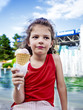 Portrait of young boy eating ice cream outdoors