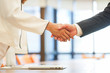 close up investor businessman handshake with partner vendor,collaboration of two ceo leader hand shake for agreement or deal financial cooperative concept.