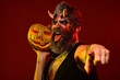 Halloween satan show tongue with bloody horns, beard, blood, wounds