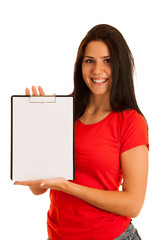 Wall Mural - attractive young woman in red with blank banner in her hands isolated over white