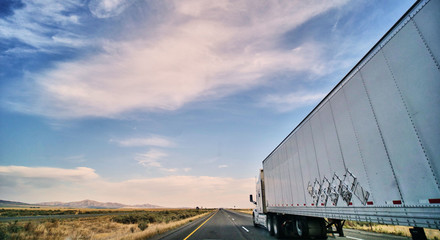 Wall Mural - freight truck on open highway in desert