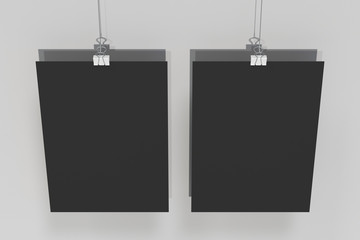 Two blank black posters with binder clip mockup on white background