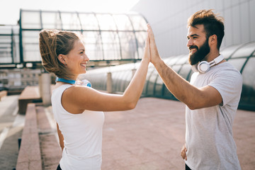 portrait of young attractive happy fitness couple