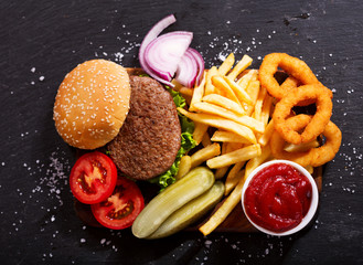 Poster - hamburger with french fries and onion rings, top view