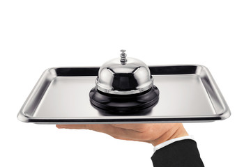 Wall Mural - Service bell / Service bell on stainless tray on hand waiter on white background.