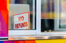 "No Refunds" Sign On A Store Front Window
