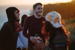 © HOWL/Stocksy - A group of friends hanging out in coastal California