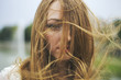 © Jovana Rikalo/Stocksy - Portrait of a beautiful young woman with hair blown by wind