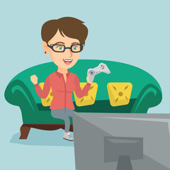 Sticker - Young happy caucasian woman playing video game. Excited woman with console in hands playing video game at home. Woman celebrating her victory in video game. Vector cartoon illustration. Square layout.