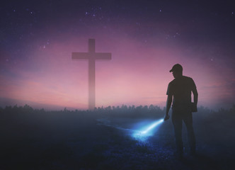 Wall Mural - man looking for cross