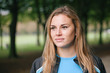 © Koen Meershoek/Stocksy - Portrait of a young woman in a park.