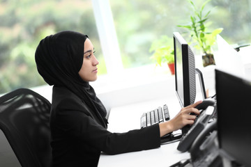 Wall Mural - Beautiful muslim lady at work