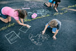 © Sean Locke Photography/Stocksy - Recess: School Students Being Creaive With Chalk Drawing