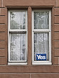 © Mellimage/Stocksy - Window with Yes sign - scottish referendum