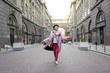 © Yakobchuk Olena - Excited mature lady enjoying walk in city