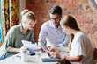 © Aila Images/Stocksy - Business Meeting in a Cafe