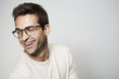 © sanneberg - Handsome glasses guy laughing in studio