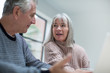 © ReeldealHD images - Senior couple discussing home finance together