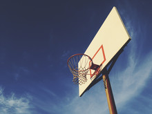 Basketball Hoop With Blue Sky In Background, Dusk