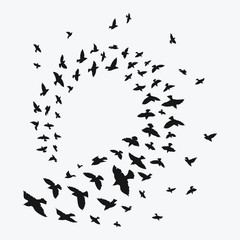 Silhouette of a flock of birds. Black contours of flying birds. Flying pigeons. Tattoo.