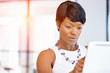 © Sergey Nivens - Young woman in office using tablet