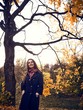 © alexeyvronsky - A young stranger strolls through the autumn apple orchard.