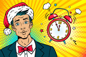Wall Mural - christmas pop art face. surprised young man in santa claus hat, suit and bow tie and bright makeup a