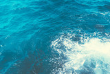 Fototapeta  - Inspiration by the sea.Boiling seawater.Background shot of aqua sea water surface with space for text.Restless water, sea waves.Top view.Indonesia.