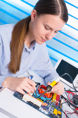 Poster - Young woman fix PC component in service center