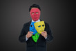 Businessmen wear red mask and hide many masks in suit.