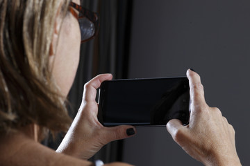 Coast woman using cellphone