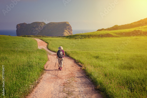 Pilgrim walking towards St Fototapeta