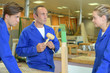 © auremar - Carpenter with male and female apprentices