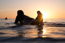 Surfer Enjoys The Sunset