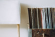 © Jacqui Miller/Stocksy - Collection of records in an old wooden box, next to a white chair