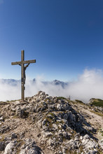 Summit Cross In Alpine Landscape