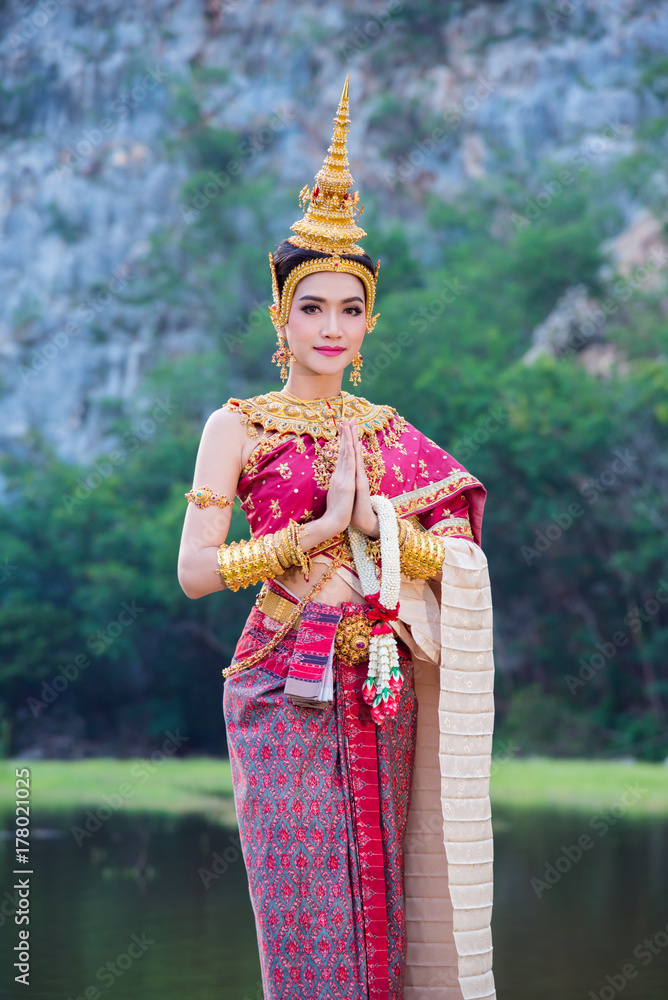 traditional thai dress RaanPahMuang Luxurious Clothing Silk Chinese Front Cut Outfit Chinese Collar 91cms)Length Thai traditional dress stock image.