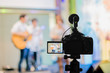 © redkphotohobby - Covering an event on stage with a video camera